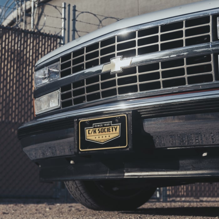 C/K Society Main Logo Embossed Front License Plate Chevrolet | GMC
